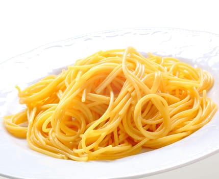 Plate Of Fresh Spaghetti. Freshly prepared spaghetti pasta without sauce on a white plate.
