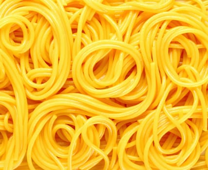 Closeup abstract background of coiled strands of spaghetti pasta