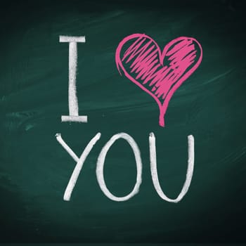 I Love You. Handwritten message on a chalkboard with an illustrated heart used as a symbol of love in this Valentines message.