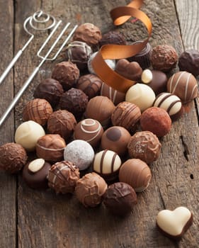 Luxury handmade chocolate bonbon assortment of delicious decorative round chocolates with a festive ribbon for a celebration