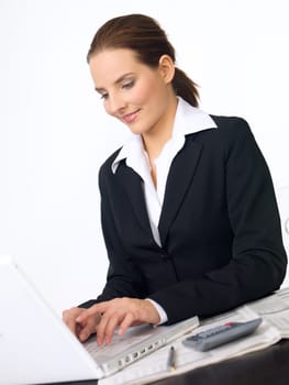 Portrait of beautiful and young business woman working on laptop