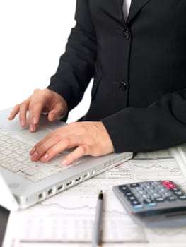 Portrait of beautiful and young business woman working on laptop