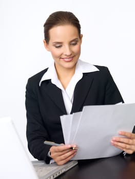Portrait of beautiful and young business woman working at the desk
