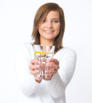 Portrait of beautiful young woman with glass of water