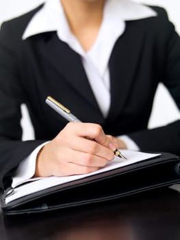 Portrait of beautiful and young business woman working at the desk