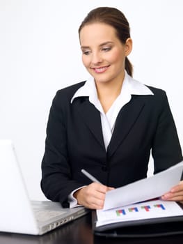 Portrait of beautiful and young business woman working at the desk