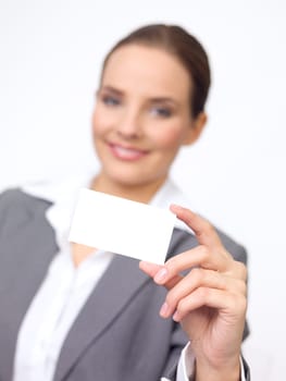Portrait of beautiful and young business woman holding empty card