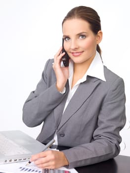 Portrait of beautiful and young business woman working on laptop
