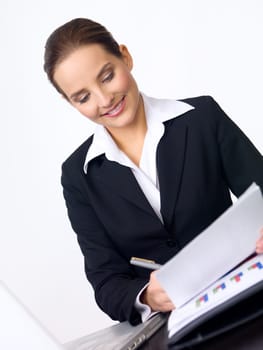 Portrait of beautiful and young business woman working at the desk