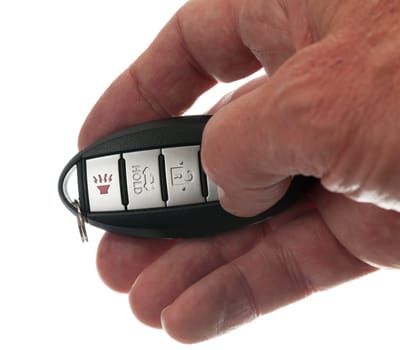 Black modern car door opener and keyless entry device with thumb pressing lock