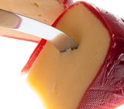 Circular round dutch covered in red wax protection with knife