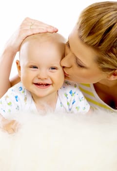 Young attractive mother kissing cute little baby