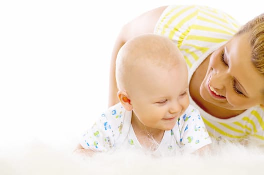 Young attractive mother kissing cute little baby