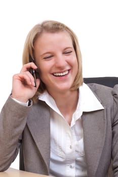 Young modern businesswoman laughing on her mobile phone