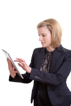 Young blonde businesswoman using a tablet pc standing in front of white background