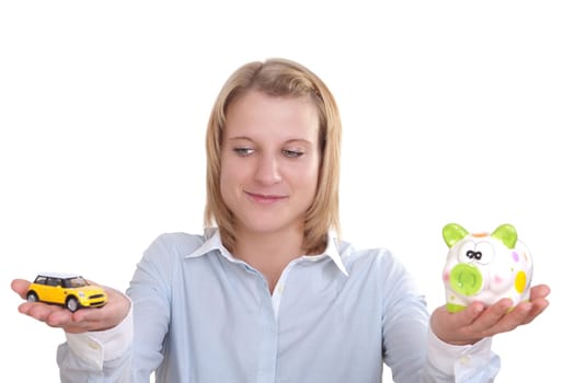 Young blonde woman holding a car in one hand and a piggy bank in the other