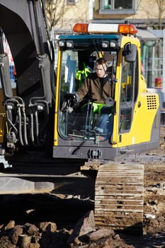 bulldozer in action, inside large building-site