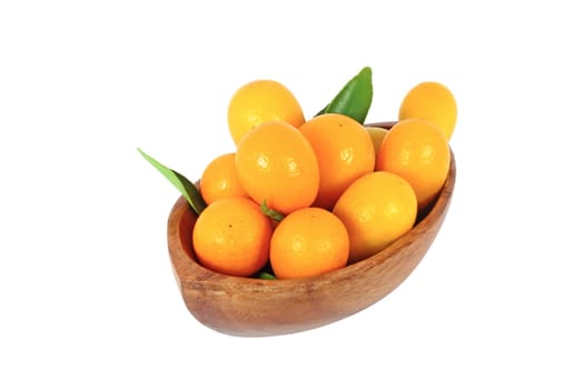 kumquat midget orange in wooden bowl isolated on white