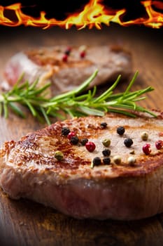 grilled meat fillet on wooden background