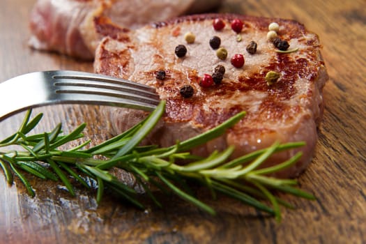 grilled meat fillet on wooden background
