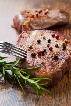 grilled meat fillet on wooden background