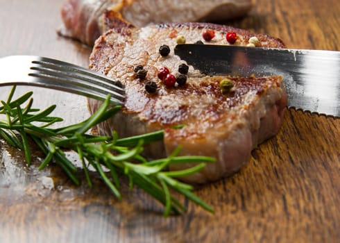 grilled meat fillet on wooden background