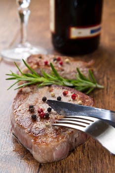 grilled meat fillet on wooden background