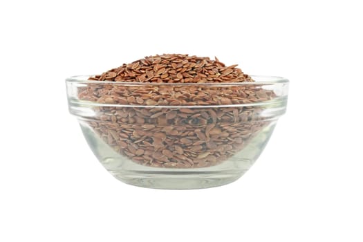 Glass bowl full of brown flax seed isolated on white