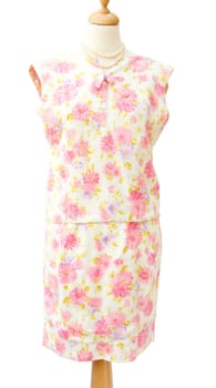 Genuine vintage 1950 woman skirt suit with pink flowers. Isolated over white background.