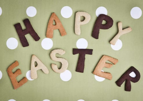 Happy Easter Card On grey green fabric. Words HAPPY EASTER on a tureen fabric background, festive card for Easter holiday.