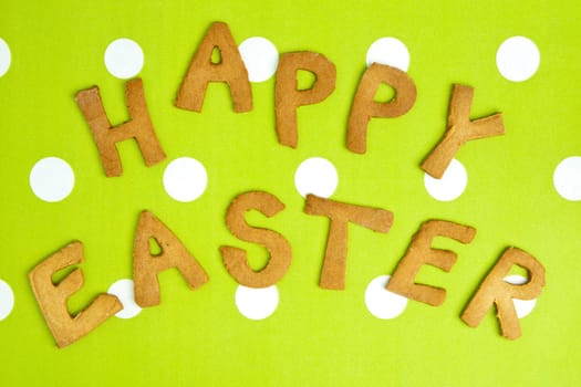 Happy Easter Card On green fabric. Words HAPPY EASTER on a tureen fabric background, festive card for Easter holiday.