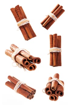 bunch of cinnamon sticks as a collage on white background isolated