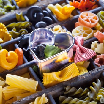 Different colored Pasta in an old letter-box