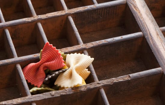 Different colored Pasta in an old letter-box
