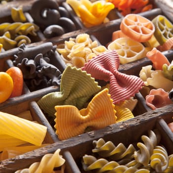 Different colored Pasta in an old letter-box