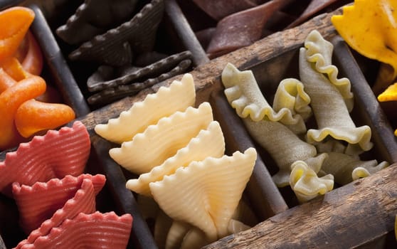 Different colored Pasta in an old letter-box