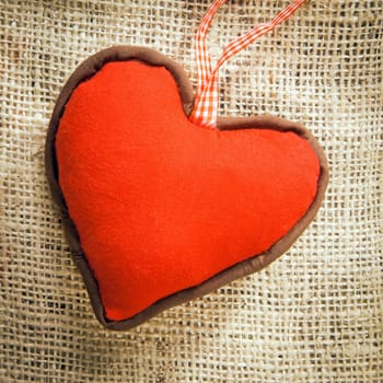 a red Heart on a textile background