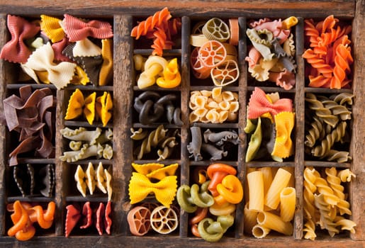 Different colored Pasta in an old letter-box