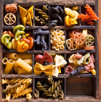 Different colored Pasta in an old letter-box