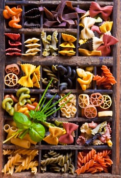 Different colored Pasta in an old letter-box