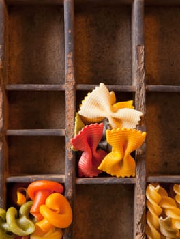 Different colored Pasta in an old letter-box