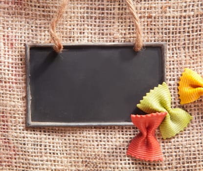 a chalkboard on a textile coffee bag with pasta
