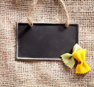 a chalkboard on a textile coffee bag with pasta