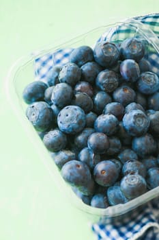 Blueberries on green background for springtime