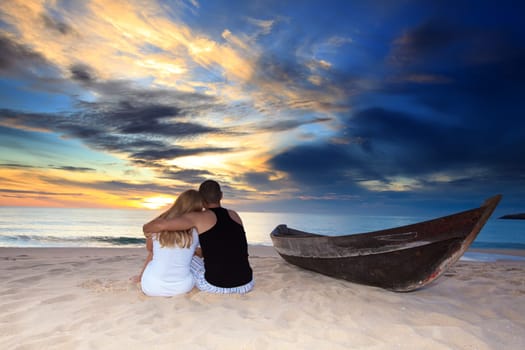 Romantic couple at uninhabited island at sunset time