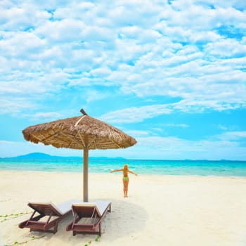 Woman enjoy sun on the tropical beach