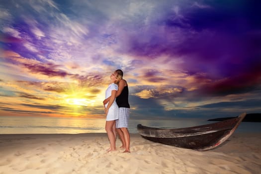Romantic couple at uninhabited island at  sunrise time