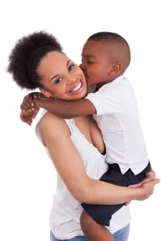 Litte black boy kissing her mother, isolated on white background