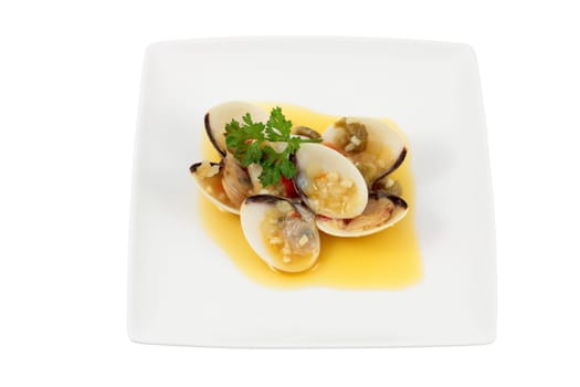 dish of clams in wine sauce and olive oil with chopped parsley and garlic pepper onion cut off and isolated