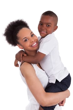 Litte black boy kissing her mother, isolated on white background